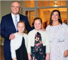  ??  ?? Australian Prime Minister Scott Morrison with his wife Jenny and their two daughters Abbey and Lily. Photo: Getty Images
