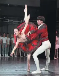  ?? PHOTOS BY JIANG DONG / CHINA DAILY ?? Left: Qiu Yunting (left) and Wu Sicong, dancers with the National Ballet of China, dancing the wedding pas de deux from Don Quixote. Right: Dancers with the ballet company perform Diamond, a chapter from Russian choreograp­her George Balanchine’s classic three-act ballet, Jewels.