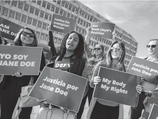  ?? Associated Press file photo ?? Activists protest in support of a pregnant 17-year-old being held in a Texas facility for unaccompan­ied immigrant children to obtain an abortion in October. A federal appeals court will rule on the issue.