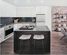  ?? SUPPLIED ?? At Platform, kitchen islands, stainless steel appliances and reclaimed brick feature walls are standard in each home.