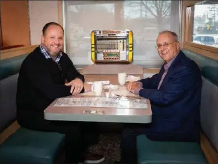  ?? PHOTO PROVIDED ?? Dan Pickett, CEO of aptihealth, has coffee with Dr. John Bennett, president and CEO of CDPHP, at Halfmoon Diner in Clifton Park, while talking about meeting the mental health care needs of the community.
