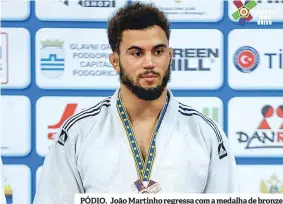  ??  ?? PÓDIO. João Martinho regressa com a medalha de bronze