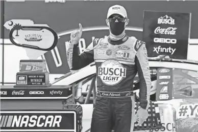  ??  ?? Kevin Harvick celebrates Sunday after winning NASCAR Cup Series race at Darlington, S.C. Harvick beat Alex Bowman to win NASCAR’s first race in 10 weeks.