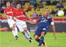  ?? Reuters ?? Monaco’s Radamel Falcao (centre) shoots at goal during the Ligue 1 home match against Montpellie­r on Friday.