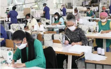  ??  ?? WORKERS produce masks at the Lontana Apparel Factory in Gardens.