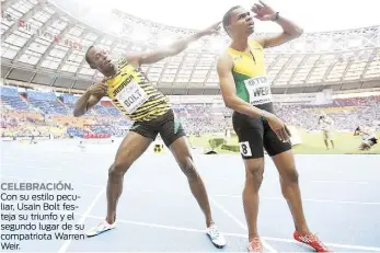  ??  ?? CELEBRACIÓ­N. Con su estilo peculiar, Usain Bolt festeja su triunfo y el segundo lugar de su compatriot­a Warren Weir.