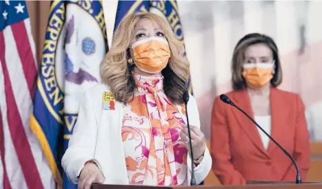  ?? J. SCOTT APPLEWHITE/AP ?? Democratic Rep. Lucy McBath, of Georgia, left, lost her son to gun violence. She joins House Speaker Nancy Pelosi, D-Calif., at a news conference Thursday about passage of legislatio­n on gun violence prevention.