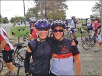  ??  ?? Tracey (right) takes a well-earned break with a fellow rider during the 2012 Big Move Cancer Ride.