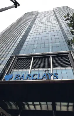  ??  ?? A view of Barclays headquarte­rs at London’s Canary Wharf financial district.