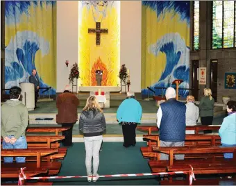  ??  ?? Church of Our Lady and St Brendan Church in now opened daily for prayer. Fr. Padraig Walsh PP on the Alter. johncleary­photo.com