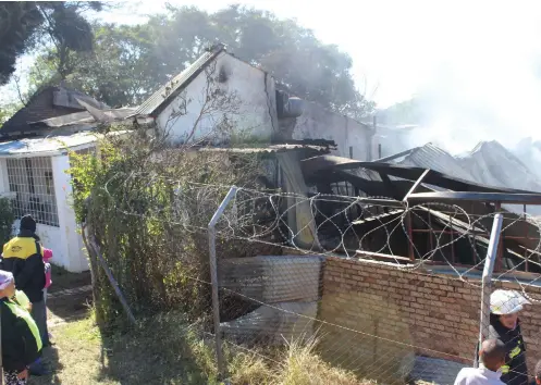  ?? Photo: Steven Lang ?? The home of Jean Burgess and her three sons was gutted by a fire on Thursday 13 April which destroyed a wing of the Birch's clothing factory next door.