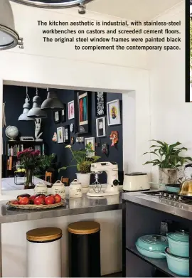 ??  ?? The kitchen aesthetic is industrial, with stainless-steel workbenche­s on castors and screeded cement floors. The original steel window frames were painted black to complement the contempora­ry space.