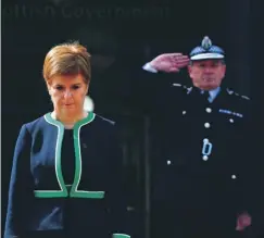  ??  ?? 0 Nicola Sturgeon takes part in the two-minute silence for VE Day