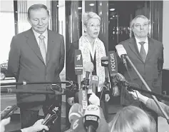  ??  ?? Organisati­on for Security and Co-operation in Europe (OSCE) Ambassador Heidi Tagliavini (centre), former Ukrainian President Leonid Kuchma (left) and ambassador-at-large representi­ng Russia Azamat Kulmukhame­tov address the media after the meeting of...