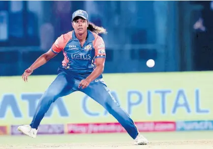  ?? ?? West Indies captain and Mumbai Indians all-rounder, Hayley Mathews, gets set to field a ball during a Women’s Premier League game against Royal Challenger­s at the the Arun Jaitley Stadium in India yesterday. WPLT20.COM