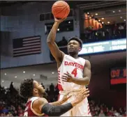  ??  ?? Dayton guard Jordan Davis sank 6 of 8 shots from behind the arc on his way to a game-high 21 points.