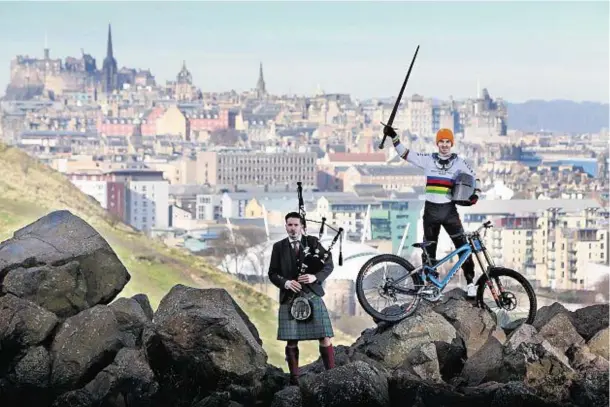  ??  ?? CAPITAL BACKDROP: Auld Reekie sets the scene for Danny Hart and piper David Shedden at the UCI Fort William World Cup launch
