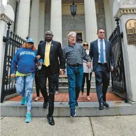  ?? HADDOCK TAYLOR/BALTIMORE SUN BARBARA ?? Victim Tanya Allen, from left, attorney Ben Crump, victim Marc Floto and attorney Adam Slater descended the steps of the Baltimore Basilica for a news conference on Tuesday.