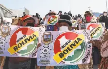  ?? Juan Karita / Associated Press ?? Protesters amid the pandemic demand the government reopen small businesses in Bolivia’s capital of La Paz.