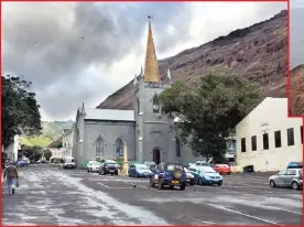  ??  ?? Jamestown, as seen from the sea, looking up the main street past St James Church, the oldest Anglican church in the southern hemisphere. Jamestown, the capital of St Helena Island with a population of 600, lies nestled in the valley, with the south...