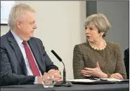  ?? AP/BEN BIRCHALL ?? British Prime Minister Theresa May and Welsh First Minister Carwyn Jones attend a meeting Monday at Liberty Stadium in Swansea, Wales.
