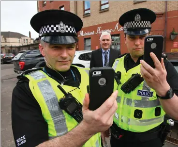  ??  ?? Joe Scott, housing manager, with Sgt Barry Gibbons, left and PC Craig Burns Picture: Colin Mearns