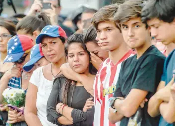  ?? — AFP ?? People take part in a protest against the death of Miguel Castillo in Caracas.