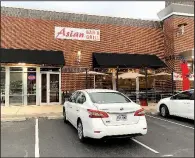  ?? Arkansas Democrat-Gazette/ERIC E. HARRISON ?? Asian Bar &amp; Grill has opened in the west Little Rock strip center at 14524 Cantrell Road in the space that has most recently housed Hawgz Blues Cafe and Whole Hog Barbecue.