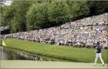  ?? AP file photo ?? Spectators look on as Jordan Spieth waits to putt on the 16th hole during the final round of the Masters on April 12, 2015.