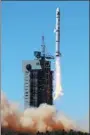  ?? PROVIDED TO CHINA DAILY ?? A Long March 2C rocket carrying a remote sensing satellite and a scientific experiment satellite — both for Pakistan — is launched at the Jiuquan Satellite Launch Center on Monday.