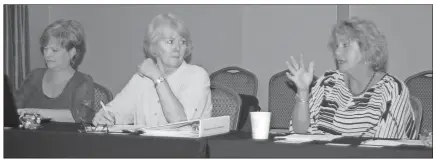  ??  ?? ABOVE: Kathy Mathis (from left), Elaine Snow and Lisa Smith react to discussion of a proposed city smoking ordinance during the Office of Tourism board meeting Wednesday.