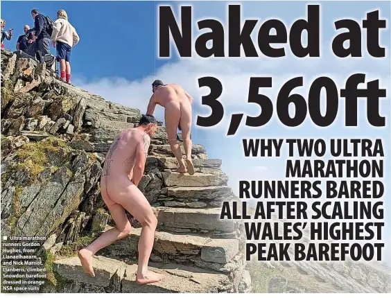  ?? ?? Ultra marathon runners Gordon Hughes, from Llanaelhae­arn, and Nick Marriot, Llanberis, climbed Snowdon barefoot dressed in orange NSA space suits