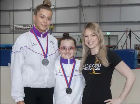  ??  ?? Wexford Gymnastics Club gymnasts Kirstin Brennan and Lily Stewart with their coach Aisling Swords.