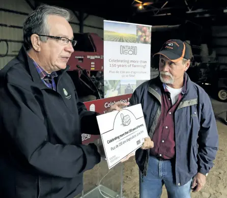  ?? CLIFFORD SKARSTEDT/EXAMINER ?? Agricultur­e, Food and Rural Affairs Minister and Peterborou­gh MPP Jeff Leal pays tribute Friday morning to Blayne Barr and his family whose family members have been farming near Warsaw, east of the city, for more than 150 years at Bargeolane Farms. The...