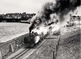  ??  ?? Another visit to Wales in July 1964 saw Dick photograph Vale of Rheidol’s No. 9 Prince of Wales running along the old formation and making a smoky departure to Devil’s Bridge.