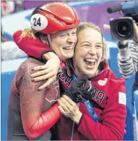  ?? THE CANADIAN PRESS/PAUL CHIASSON ?? Canada’s Kim Boutin is hugged by teammate Marianne St-Gelias after finding out she has won the bronze medal in the women’s 500-metre shorttrack speedskati­ng final at the Pyeonchang Winter Olympics Tuesday in Gangneung, South Korea.