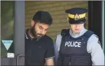  ?? Canadian Press photo ?? Truck driver Jaskirat Sidhu walks out of provincial court after appearing for charges due to the Humboldt Broncos bus crash in Melfort, Sask., on Tuesday.