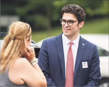  ?? Tyler Sizemore / Hearst Connecticu­t Media ?? Republican candidate for state Senate Ryan Fazio campaigns outside the District 12 polling center at North Mianus School in the Riverside section of Greenwich on Tuesday. An hour after the polls closed in the three-way race for the empty seat in the 36th Senate District, Fazio claimed victory over Democrat Alexis Gevanter and petition candidate John Blankley.