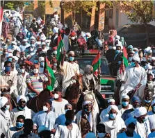  ?? AFP ?? Sudanese mourners attend the funeral procession of Sudan’s former prime minister and top opposition figure Sadiq Al-Mahdi, in Khartoum, on Friday.