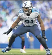  ??  ?? AP PHOTO Outside linebacker Derrick Thomas and the rest of the Tennessee Titans have a big task on their hands if they hope to beat the defending Super Bowl champs New England Patriots in one of today’s AFC playoff games.