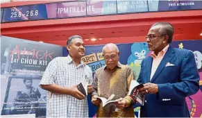  ??  ?? Turning pages: (From left) Syahril, Ghani and Shafee at during the book launch.