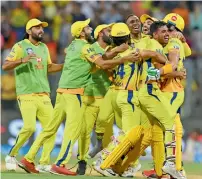  ?? AFP ?? Chennai Super Kings players celebrate after winning the IPL Twenty20 first qualifier against Sunrisers Hyderabad. —