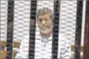  ?? TAREK EL-GABBAS / AP ?? An Egyptian criminal court Tuesday sentenced Egypt’s ousted Islamist President Mohammed Morsi to 20 years in prison over the killing of protesters in 2012, the first verdict to be issued against the leader.
