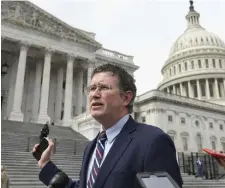  ?? AP ?? NOT WINNING FANS: Rep. Thomas Massie, R-Ky., leaves Capitol Hill in Washington, D.C., Friday after attempting to slow action on a $2.2 trillion coronaviru­s economic stimulus package but the House passed it .