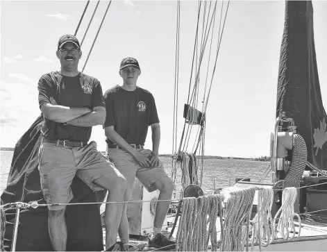  ?? DESIREE ANSTEY/JOURNAL PIONEER ?? Adam Yardy, left, coxswain on the HMCS Oriole, is shown with Ordinary Seaman Dillan Jermey.