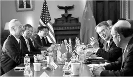  ??  ?? US Trade Representa­tive Robert Lighthizer ( second from right) with China’s Vice Premier, Liu He ( left), during the opening of US-China trade talks in Washington last month