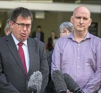  ?? PHOTO: GLENN HUNT/AAP ?? Barbara McCulkin’s nephew, Brian Ogden (right) reads a statement outside Brisbane Supreme Court after Vincent O’Dempsey was found guilty.