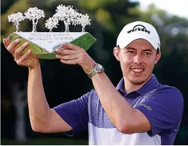  ?? GETTY IMAGES ?? Prize guy: Fitzpatric­k holds the trophy aloft yesterday