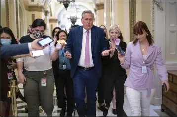  ?? J. SCOTT APPLEWHITE — THE ASSOCIATED PRESS ?? House Minority Leader Kevin McCarthy, R-Calif., heads to his office surrounded by reporters at the Capitol in Washington.