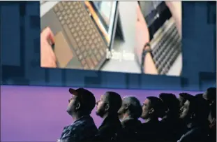  ?? PHOTO: AP ?? Audience members look on during a keynote address at the Microsoft Build 2017 developers’ conference in Seattle.